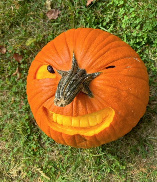 Mischievous Winking Jack-O'-Lantern with Toothy Grin