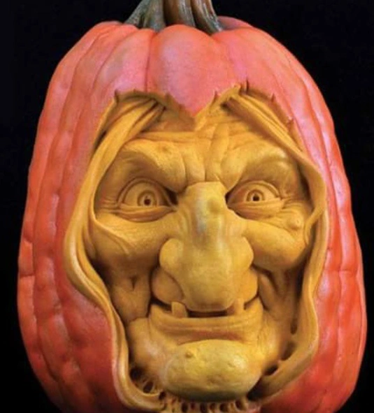 Two Pumpkins With Human-Like Expressions Next to Beer