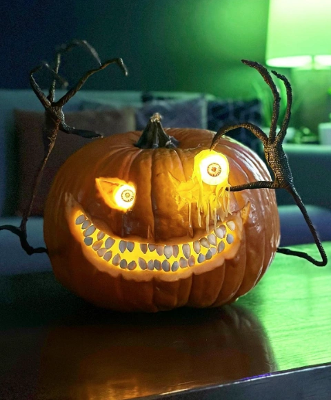 Eyeball Pumpkin with Bony Hand Accents and Seed Teeth