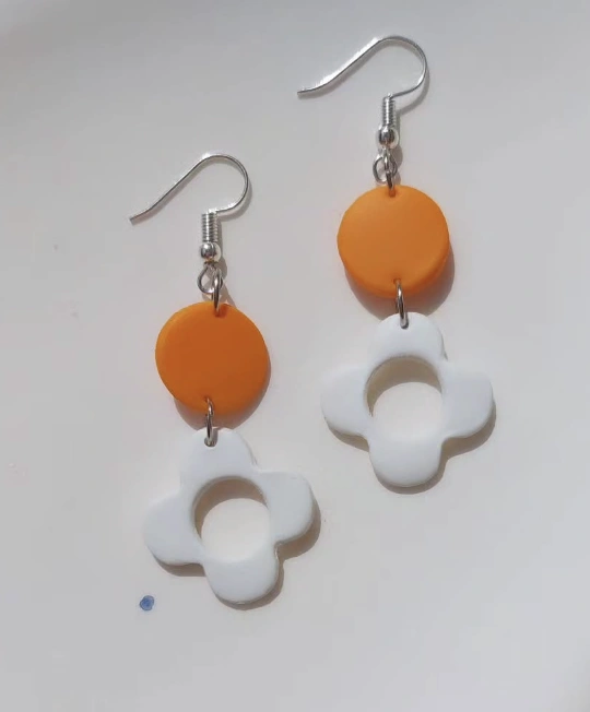 Floral Relief Drop Earrings: White Oval Base with Rose Detail