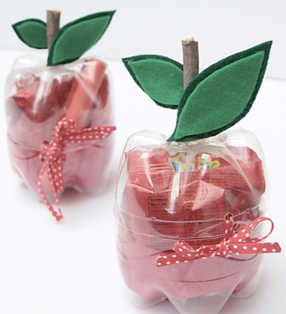 Repurposed Plastic Bottles Transformed into Apple-Shaped Treat Holders