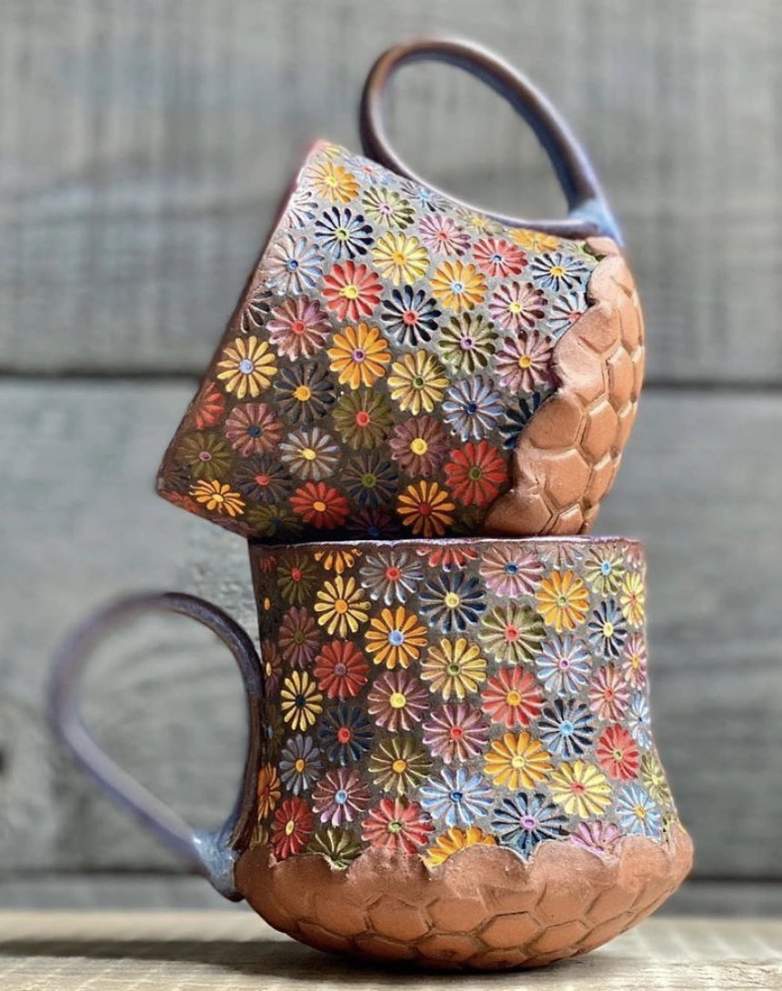 Eclectic Pottery Display: Textured Vases & Botanical Motifs