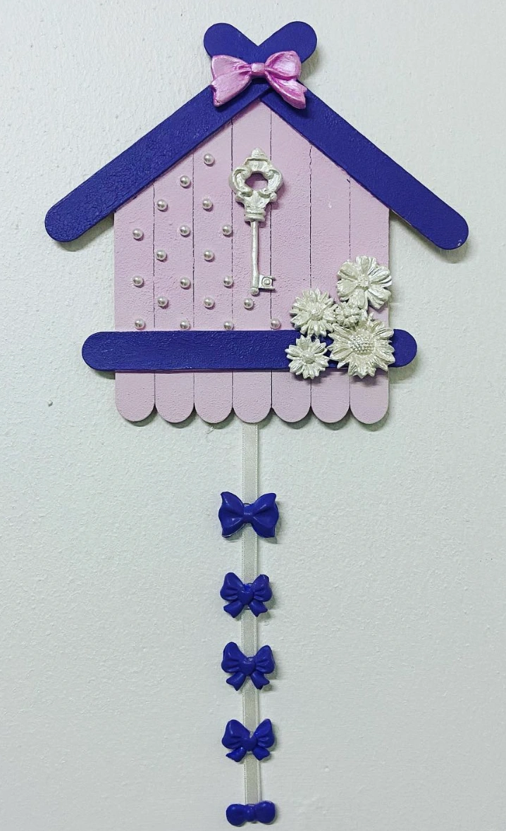 Festive Christmas Tree Ornaments Crafted From Popsicle Sticks, Paint, and Glitter
