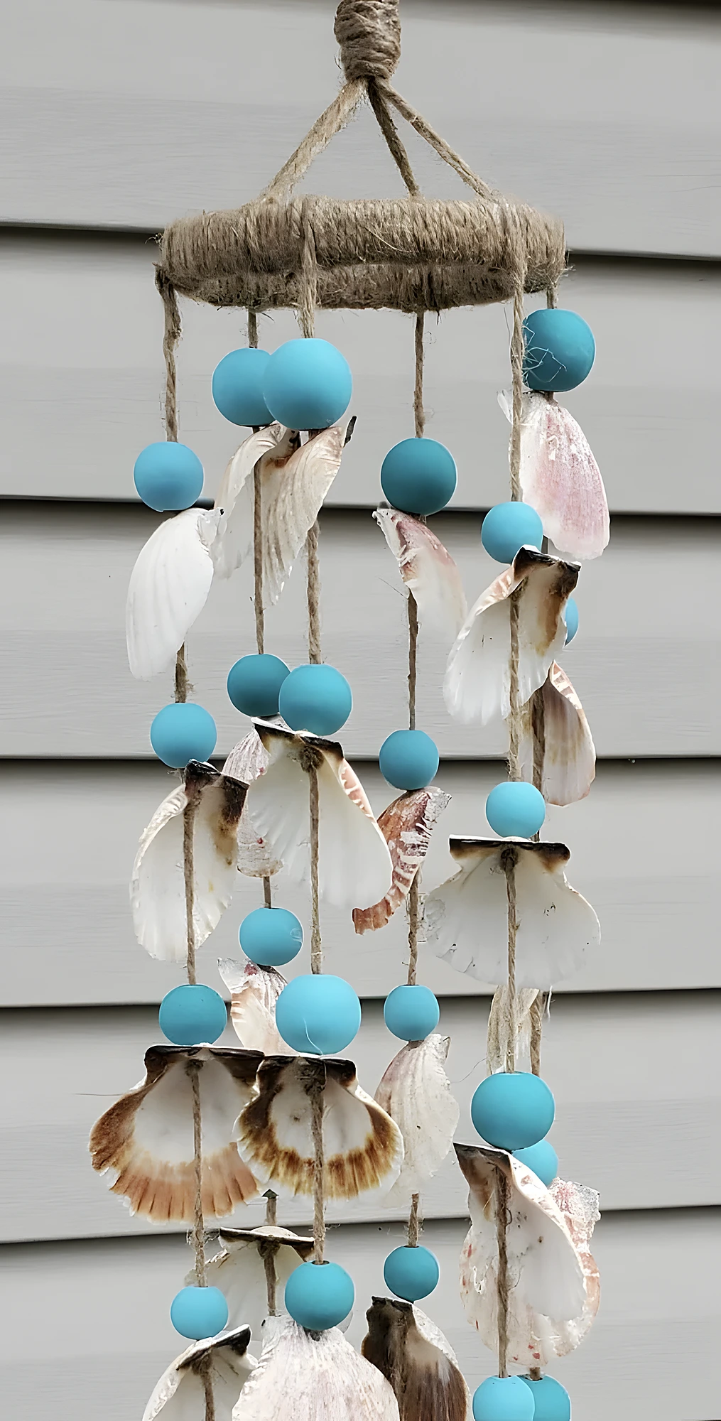 Shell-Lined Wind Chime with Soft Blue Beads and Driftwood Top
