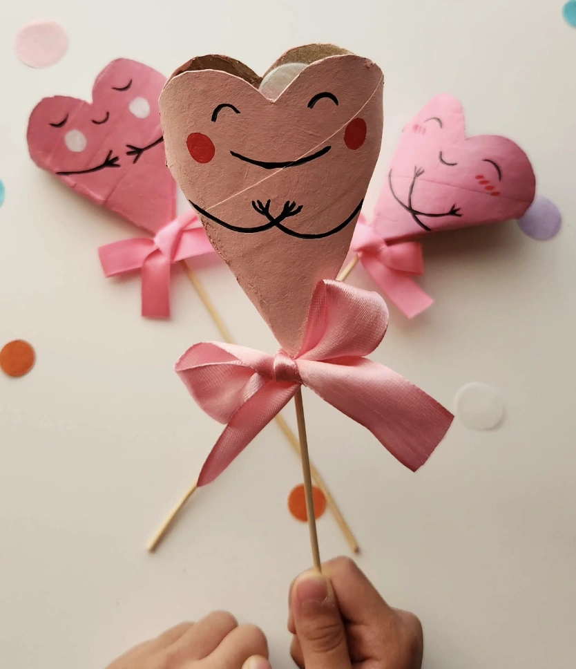 Brown Paper Heart Pouches With Red Stitching and Chocolate