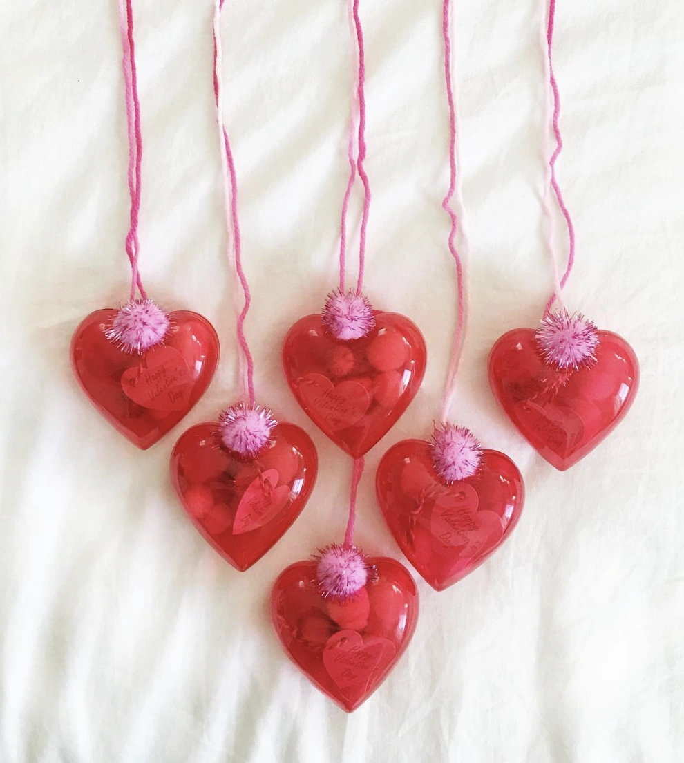Hanging Red Heart Ornaments Filled with Treats and Tags